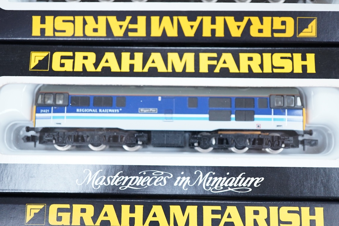Four boxed Graham Farish N gauge railway Class 31 Co-Co diesel locomotives; a BR, 31 552 (806A), an EWS, 31 466 (806B), a BR, 31 205 (8066) and a Regional Railways, 31 421 (8067).